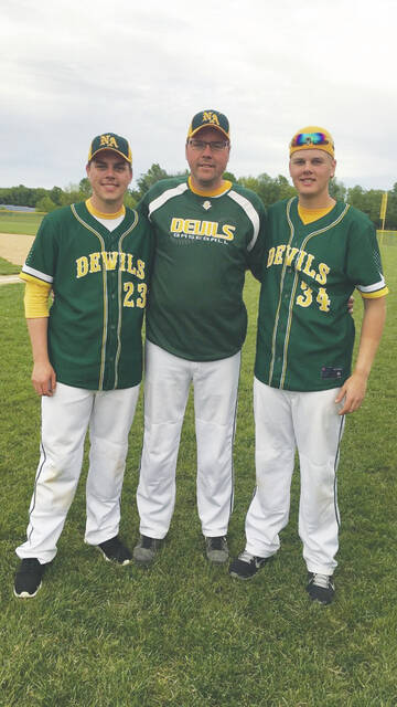 Rob Meade with his oldest pair of twin sons, Cole and Trey.