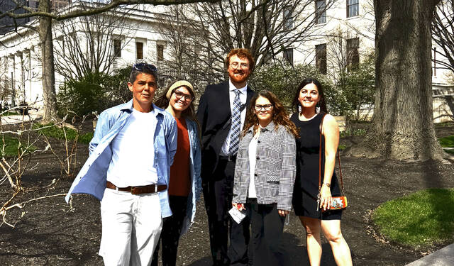 Adams County residents gather outside the Ohio Statehouse on Thursday, April 2, 2026, prior to a unanimous vote by the Ohio Ballot Board to certify a proposed constitutional amendment that would prohibit the construction of data centers with a peak load exceeding 25 megawatts. Pictured (l-r): Nikki Gerber, Danielle Nicole Kinhalt, Austin Baurichter(Georgetown), Angel Shelton, and Emily Harper. (Submitted by Nikki Gerber)