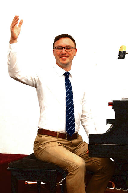 Voices of Appalachia Director Brandon Stroup is pictured during a recent rehearsal, leading the choir as it prepares for its upcoming I Will Rise performances in West Union. (Photo submitted by Brandon Stroup)
