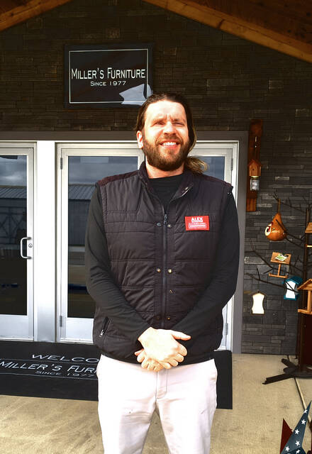 Alex Schaffer, candidate for Adams County Commissioner, stands in front of Millers Furniture after discussing his campaign priorities ahead of the May primary election. (Photo by Ryan Applegate)