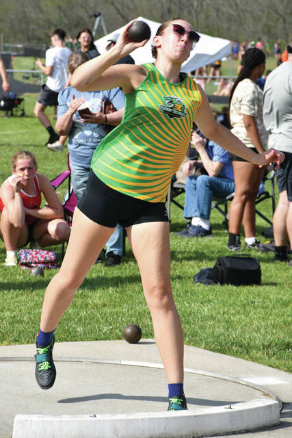 (West Unions Shelbi Weakley fires off a shot put attempt during the April 14 West Union Invitational. In the girls discus event, Weakley broke her own school record with a throw of 953. Photo by Mark Carpenter)