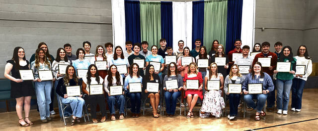 Scholarship recipients gather for a group photo following the Adams County Community Foundations second annual scholarship banquet held April 20, 2025 at the Winchester Church of Christ in Christian Union gymnasium. The foundation awarded 67 scholarships this year, continuing its growth since its founding seven years ago. (Photo by Ryan Applegate)