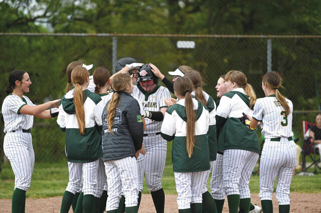 This is a familiar scene for this years North Adams softball squad- greeting freshman Chloe Armstrong at home plate after a home run, 11 times to be exact. Armstrong stroked homers 10 and 11 in last weeks 12-0 win at West Union.(Photo by Tim Daulton)