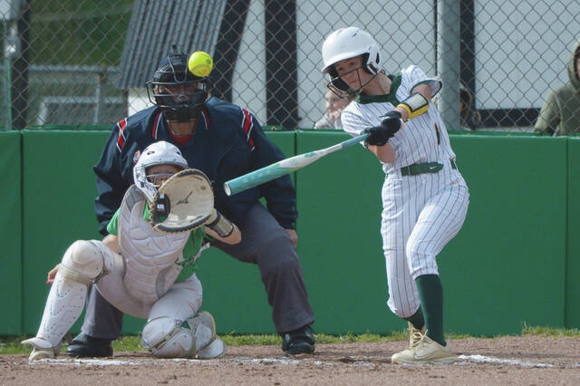 North Adams Paige Evans, as she normally does, makes solid contact with this pitch as Evans and the Lady Devils clinched the SHAC big school title with a 12-0 April 29 win at West Union. (Photo by Tim Daulton)
