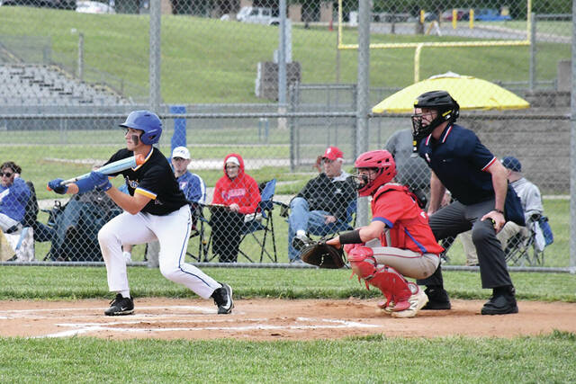Manchesters Clayton Colvin squares to bunt in the Greyhounds SHAC battle with Peebles on May 5. It was Colvin who later played hero, getting a walkoff hit in the bottom of the seventh to give his team a 7-6 victory. (Photo by Mark Carpenter)