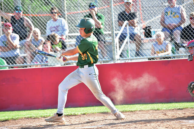 Lefty swinging Hunton Shiveley of North Adams follows through on a swing in action from the Devils district tournament loss to Symmes Valley on May 19. (Photo by Kayla Niece/Captured by Kay Photography)