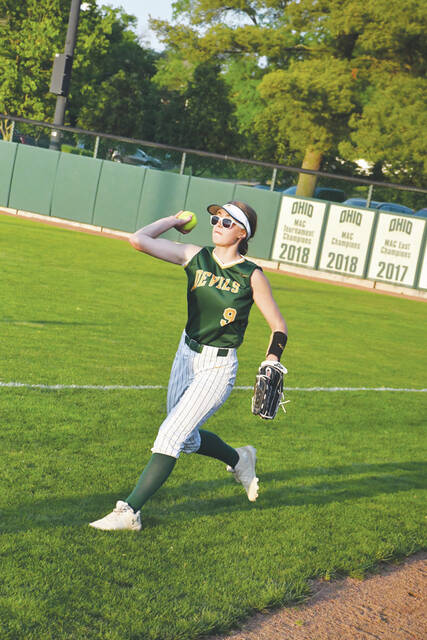 North Adams right fielder Melanie Wood returns the ball to the infield during the Lady Devils 4-1 defeat to Southeastern in the district semifinals at Ohio University. (Photo by Mark Carpenter)