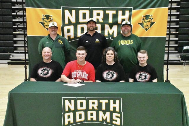 Front row, From left, Chris Roush (father), Cooper Roush, Heather Roush (mother) and Lukas Roush (brother); Back row, from left, Bryant Lung (NAHS Asst. Baseball Coach), Ryan Unger (NAHS Head Baseball Coach) and J.R. Gill (NAHS Asst. Baseball Coach). (Photo by Mark Carpenter)