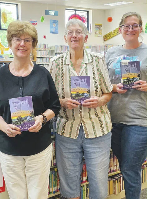 Pictured from left to right, Elaine, Margi, and Hannah. Book club members gathered on Thursday, July 23 to discuss <em>All the Missing Pieces</em> by Catherine Cowles, the first book in this spicy romance series. New members are always welcome to join future discussions.