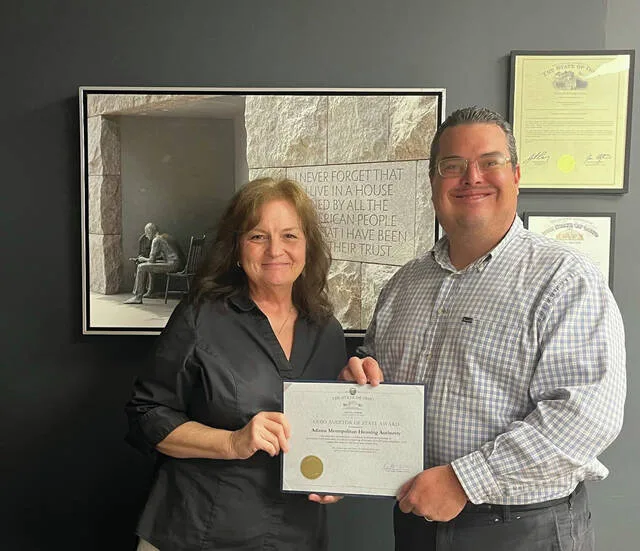 The Adams Metropolitan Housing Authority (AMHA) has been recognized for its outstanding financial stewardship by receiving the prestigious Ohio Auditor of State Award for the fiscal year ending 2025. The award was presented to Executive Director Sherry Barr by Mr. Ryan Holiday, on behalf of Ohio Auditor of State Keith Faber.