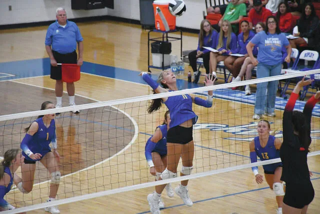 Manchester sophomore Hayden Rideout elevates for the kill attempt as the Lady Hounds battled Eastern Brown in the SHAC Volleyball Preview. (Photo by Mark Carpenter)