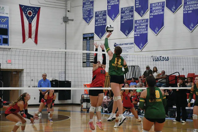 North Adams sophomore Sophia Barlow (12) rises for one of her many kill attempts as the Lady Devils battled Fairfield in the final match of this years SHAC Volleyball Preview. (Photo by Mark Carpenter)