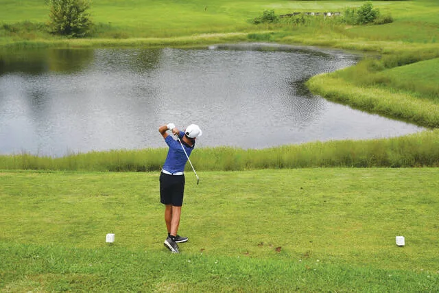 Manchester sophomore Luke Rigdon tees off on Hole #10 at Hilltop during action from last weeks Adams County Cup Tournament. (Photo by Mark Carpenter)