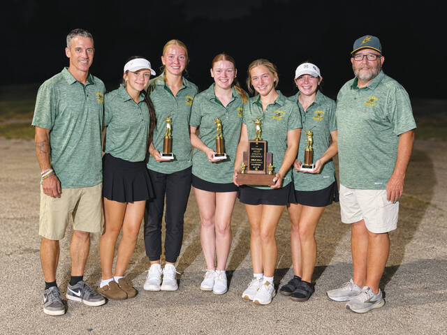 The North Adams Lady Devils finished as runner-up in the 2026 SHAC Girls Golf Tournament. From left, Head Coach Brandon Grooms, Esmee Grooms, Lilly Parker, Brooklyn Mahan, Abbie Fields, Brynlee Willett and Assistant Coach Mark Willett. (Photo provided by the Southern Hills Athletic Conference)